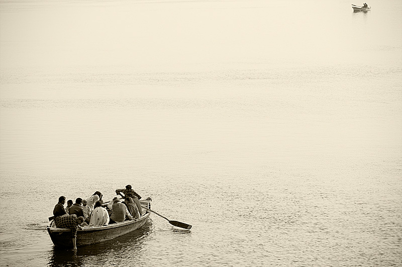 Boat tours on the Ganges row toward each other. - Varanasi, Uttar Pradesh, India - Daily Travel Photos