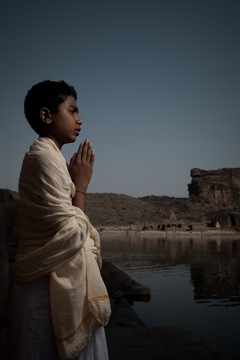 A young boy Brahman at the water tank. - Badami, Karnataka, India - Daily Travel Photos