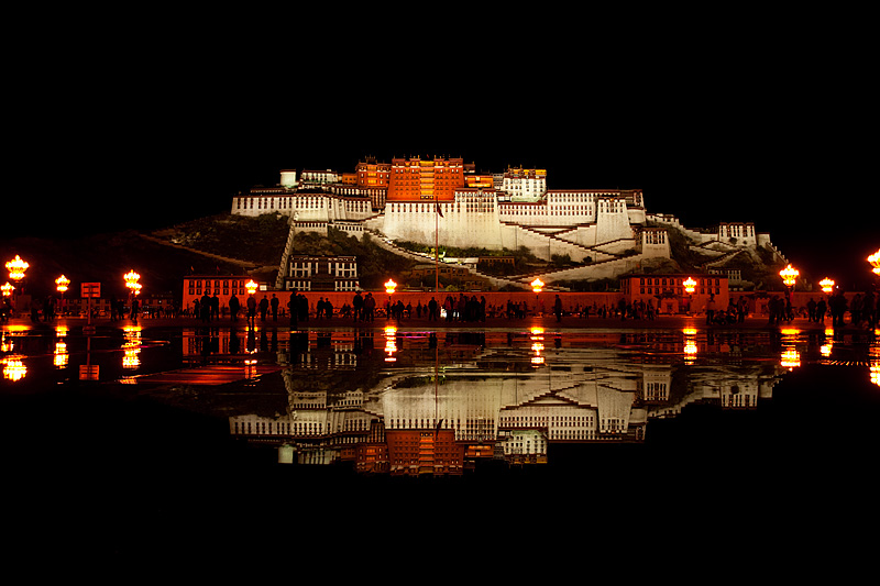 Night water fountain show in front of a reflected Potala Palace - Lhasa, Tibet - Daily Travel Photos