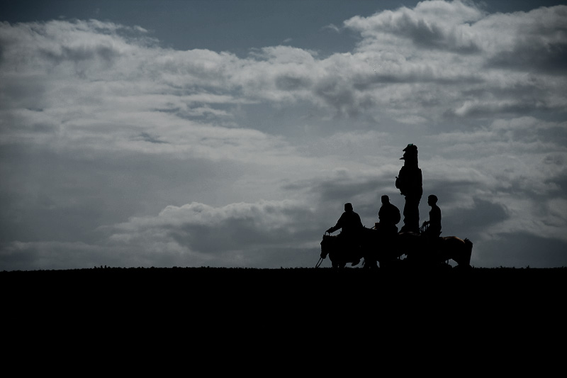 Men on horses circle a post for good luck. - Ulaan Baatar, Mongolia - Daily Travel Photos