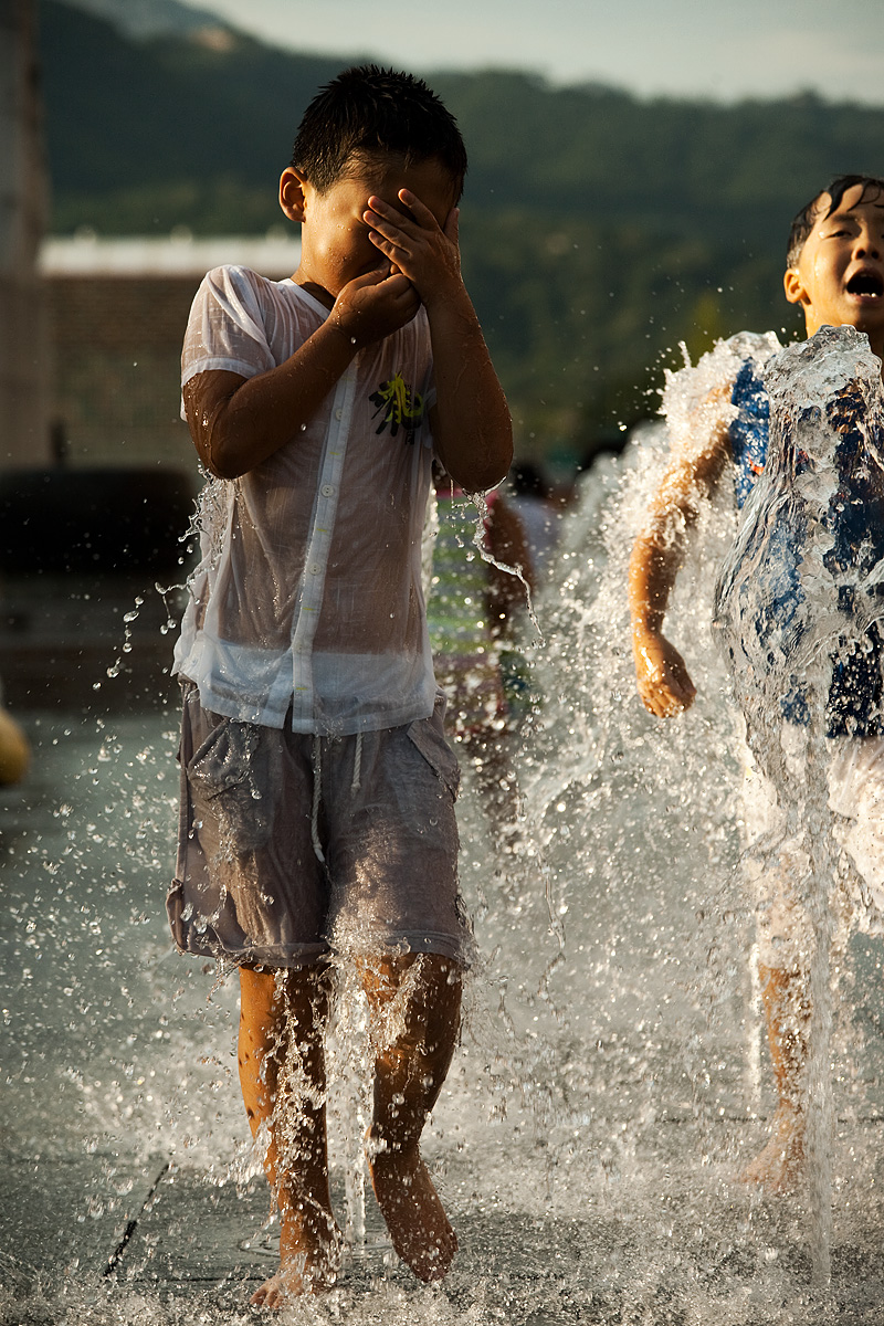 Summer Yi Sun Shin Statue Fountain Young Boys Play - Seoul, South Korea - Daily Travel Photos