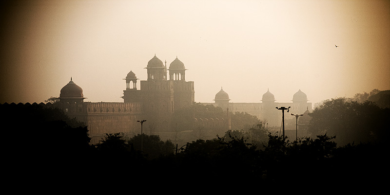 The Red Fort's wall and domes faintly visible from a distance. - Delhi, India - Daily Travel Photos
