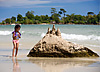 Sandcastle Photo: On Victory Beach, a young Cambodian girl builds a sandcastle on a rock.  It's a scientifically verifiable fact that Cambodian kids are the cutest children on earth... it's science and therefore, can't be disputed.