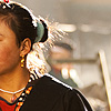 Tibetan Chic (The Barkhor III) Photo: A modern Tibetan woman navigates the alleyways around the Barkhor area of Lhasa.