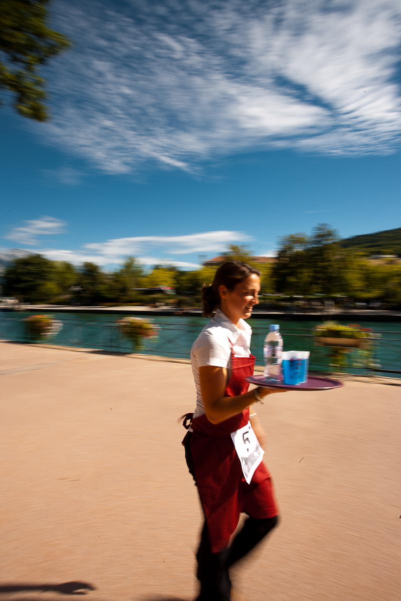 Cute waitress hamming for the camera nearly drops her drinks at the Waiter's Run - Annecy, Haute-Savoie, France - Daily Travel Photos
