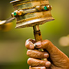 Mantra Mace Photo: Tibetan women spin mani (prayer wheel) while chanting mantras (archived photos, on the weekends).