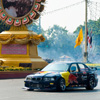 Bangkok Formula One Photo: A Red Bull stunt car takes a few hazardous laps around Ratchadamnoen street at over 100mph.