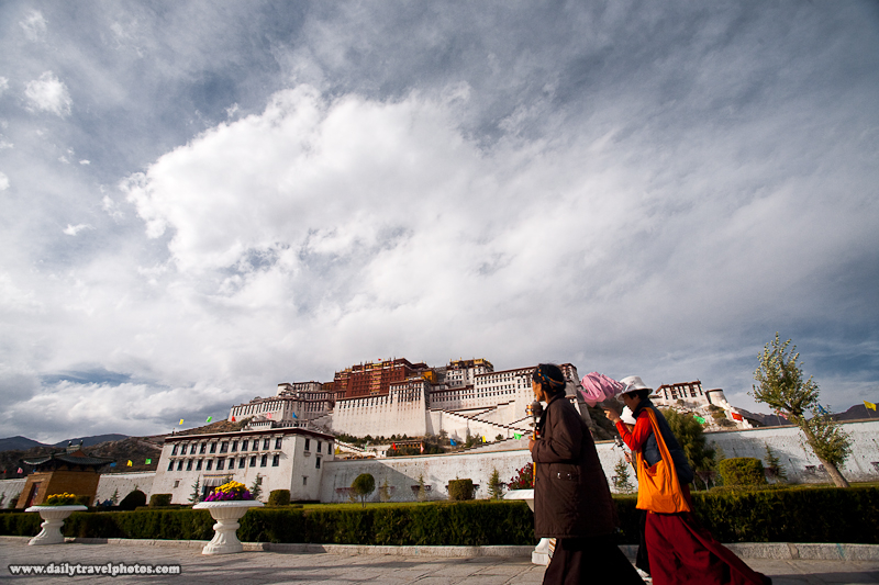 Two Traditionally Dressed Tibetan Women Walk In Front of Potala Palace - Lhasa, Tibet - Daily Travel Photos