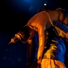 photo: Thai Dance Puppet Master - A male Thai traditional dancer slings an inanimate female dancer over his shoulder.