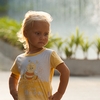 photo: Li'l Fashion Model - A young tourist girl unleashes impromptu runway modeling outside the Paragon Mall in Bangkok.