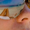 photo: Shades Reflection - A pair of sunglasses reflect the owner's legs and lovely Gili Trawangan beach (ARCHIVED PHOTO on the weekends - originally photographed 2006/10/22).